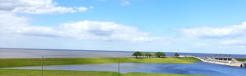 That Long Green Hill Is Holding Back A Whole Lake