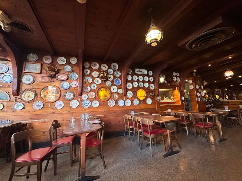 Walls Packed With Plates, Clippings, And Family Faces