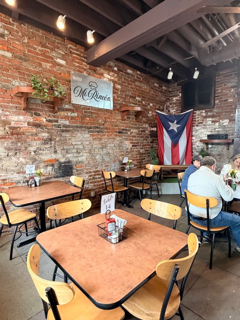 Cozy Tables, Island Music, And A Sunny Patio