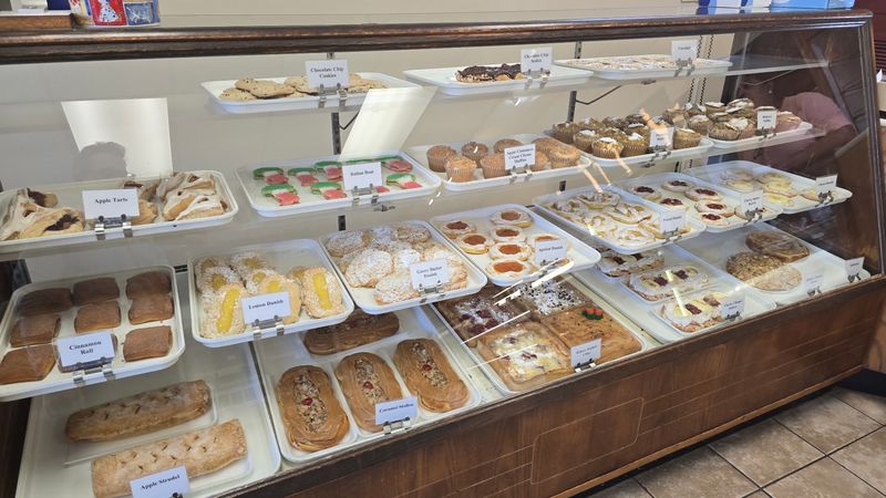 Three Glass Cases Packed With Old-World Pastries