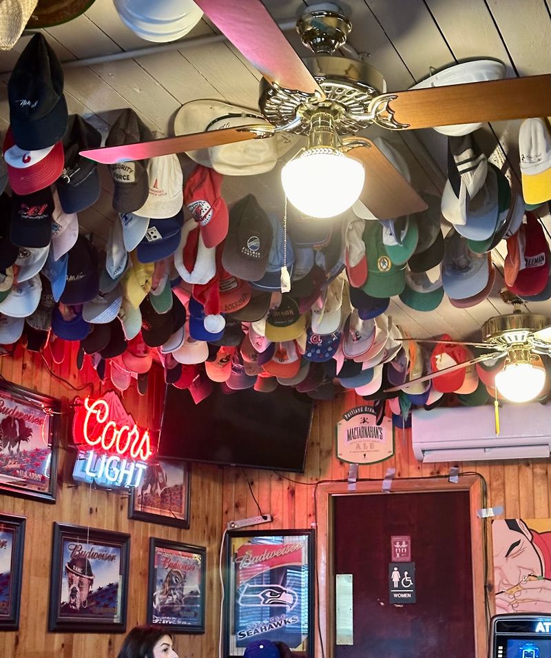 A Ceiling Covered in Baseball Caps