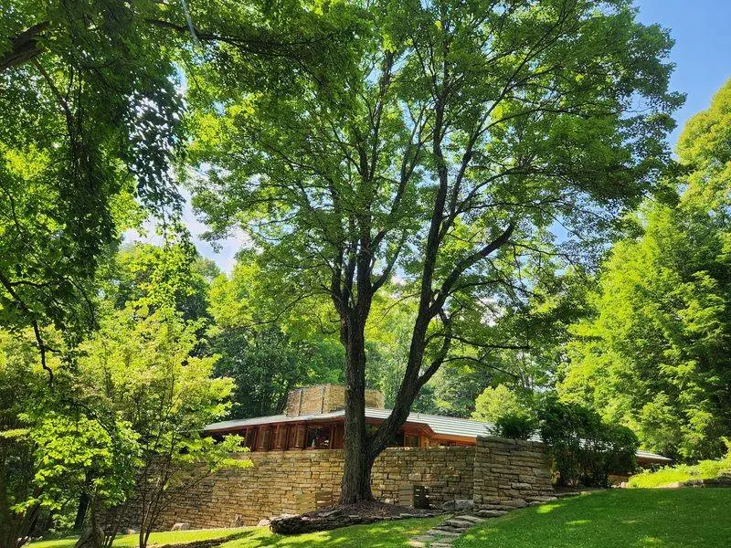 Stone, Cypress, And Copper Make This House Blend Right Into The Woods