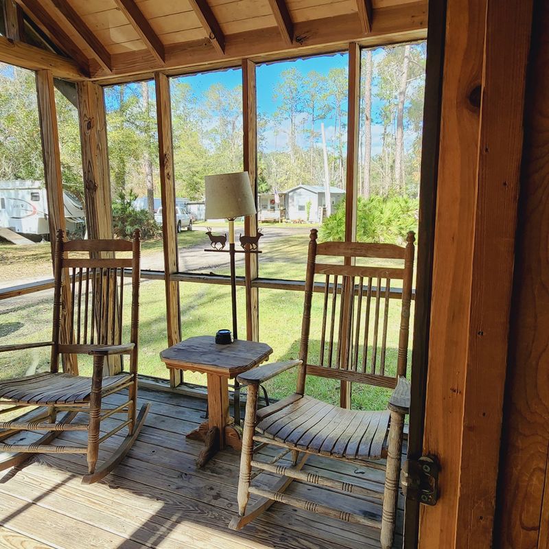 Rustic Cabins With Screened Porches And Rocking Chairs