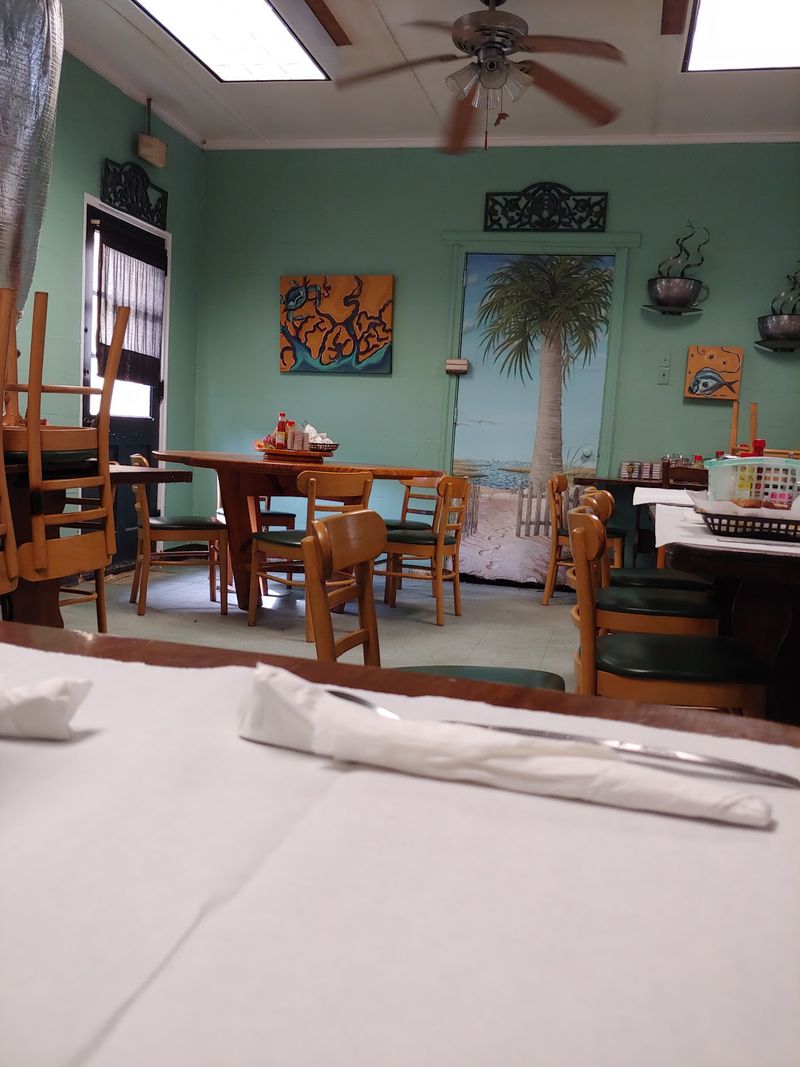 Green Walls And Vintage Signs Make Breakfast Feel Like A Time Machine