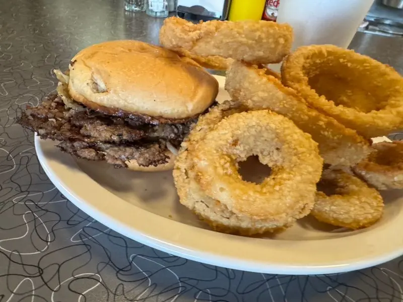 Smashed Flat, Grilled With Onions, Tucked In Soft Buns