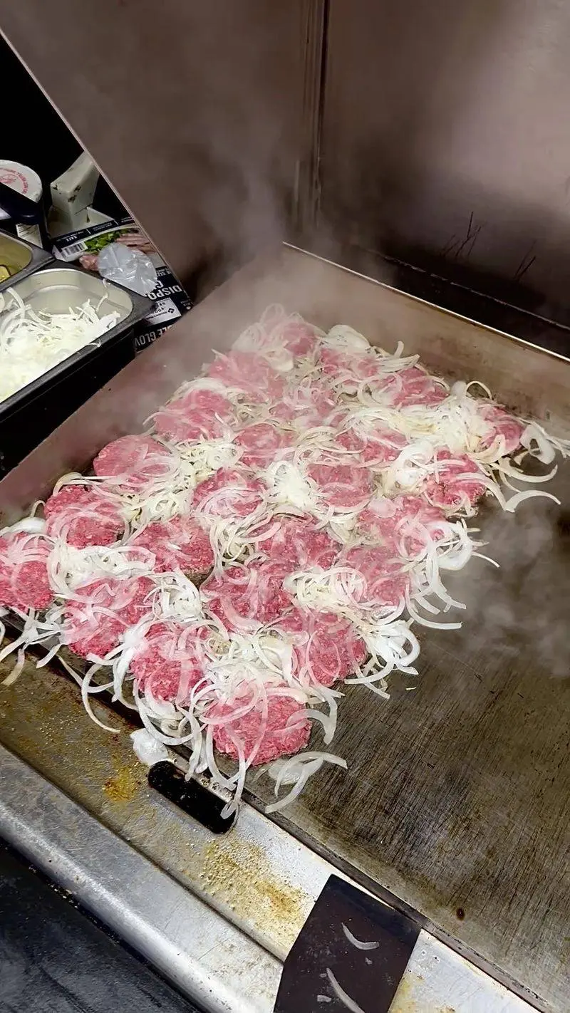 Watch The Onions Sizzle Beneath The Sliders