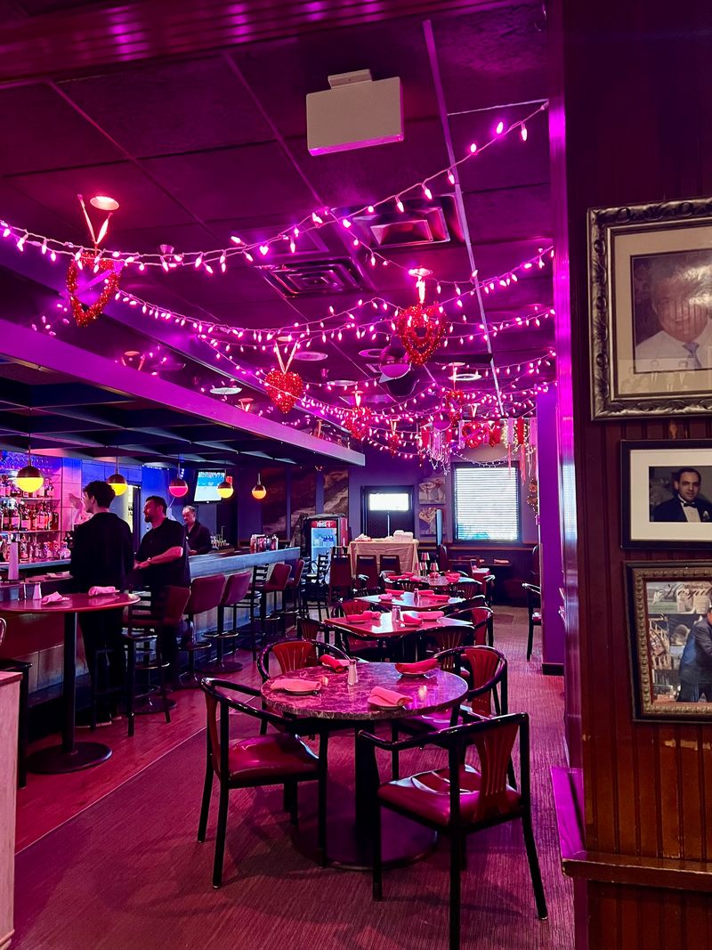 Red-Leather Booths And Twinkle Lights Set The Mood