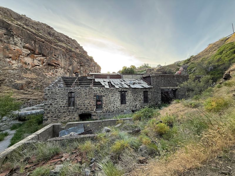Eerie Powerhouse Ruins Waiting At The Canyon Floor