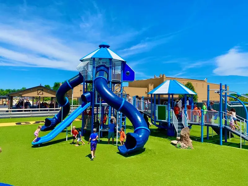 Misting Stations, Swings, And A Merry-Go-Round For Little Ones