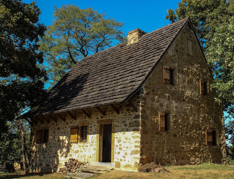 A Massive Chimney And A Steep Roof Reveal Old-World Roots