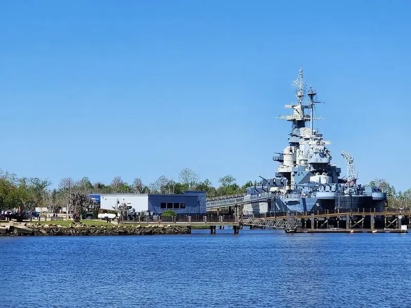 That Giant Gray Ship Across the River Steals Every Photo